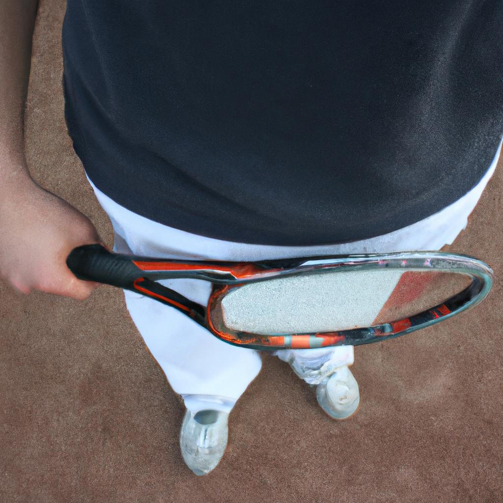 Person holding tennis racket, practicing
